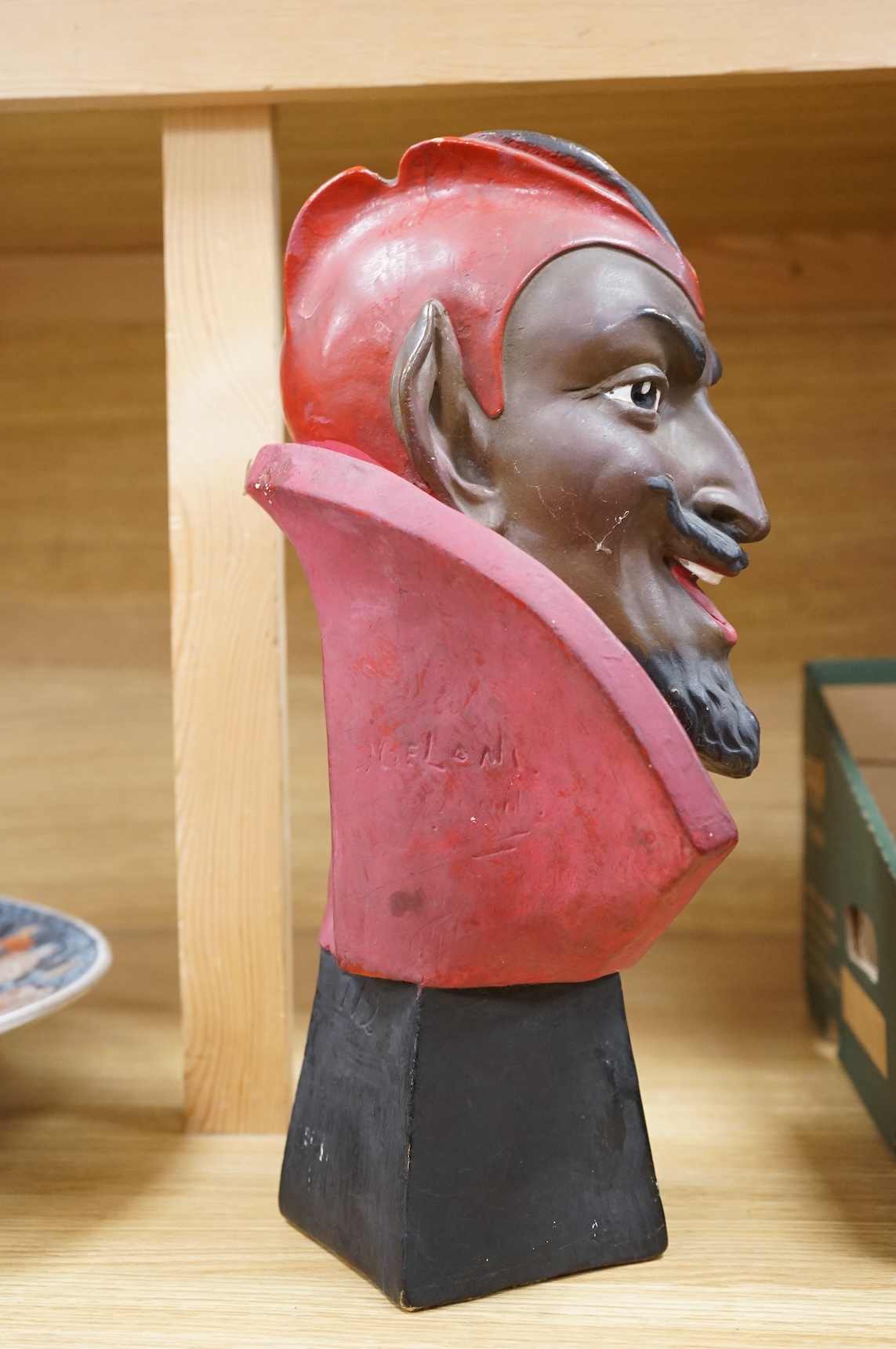 An Art Deco painted pottery bust of Mephistopheles, signed Joel Oni?, 38cm